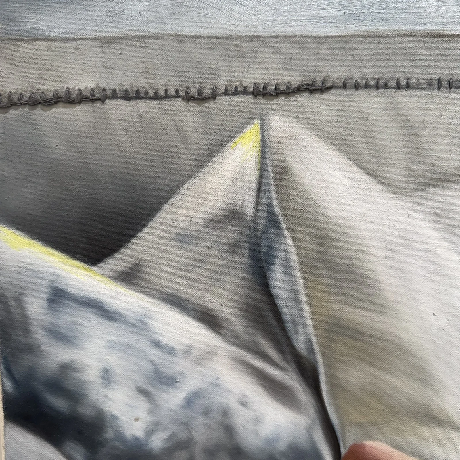 Detail of the stitching, beads and paint